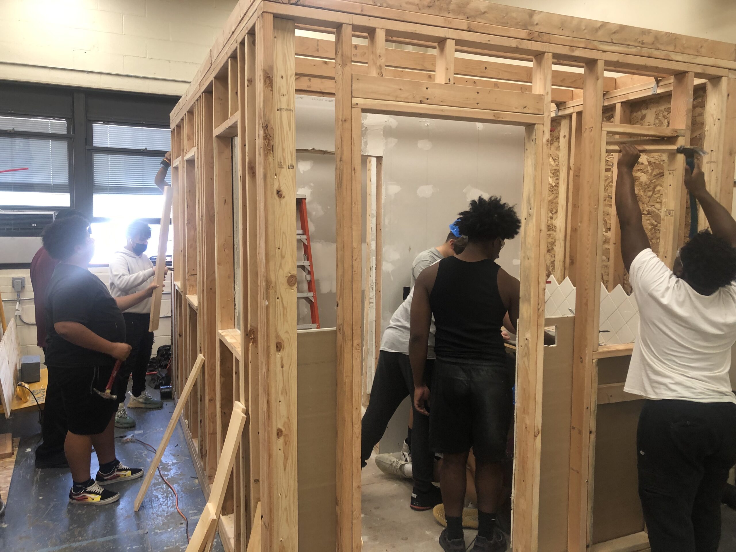 Students in Mr Smith's Construction Trades class learn the basics of framing.